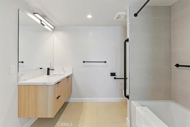 321 S Oxford Ave Unit 606, Los Angeles, CA 90020 - bathroom featuring a tub to relax in, double vanity, tile patterned floors, a shower, and baseboards