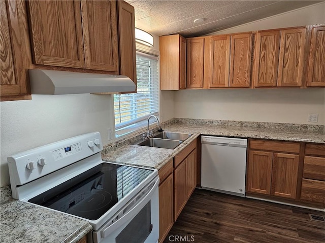 2890 7th St, Clearlake, CA 95422 - kitchen with white appliances, under cabinet range hood, a sink, dark wood-type flooring, and brown cabinetry