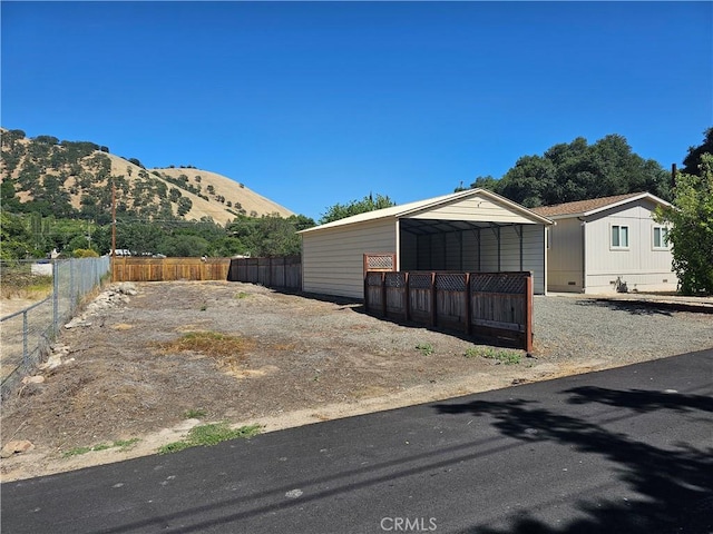 2890 7th St, Clearlake, CA 95422 - view of side of property with a mountain view and a detached carport