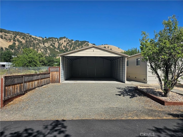 2890 7th St, Clearlake, CA 95422 - view of front of property featuring a detached carport, driveway, and a mountain view