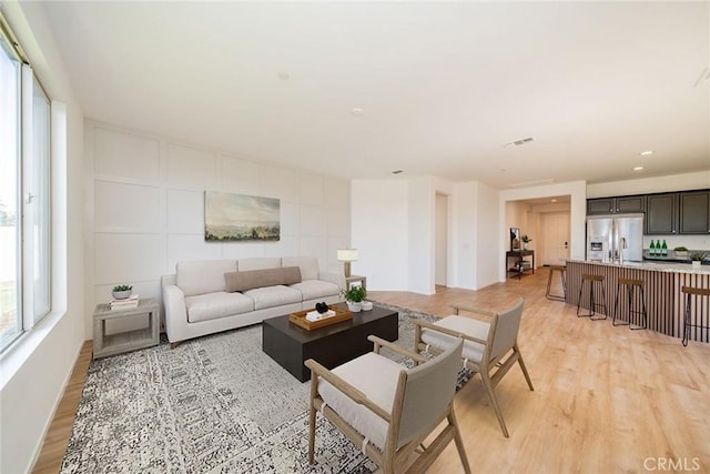 1060 Fortuna St, Perris, CA 92571 - living room featuring light wood finished floors