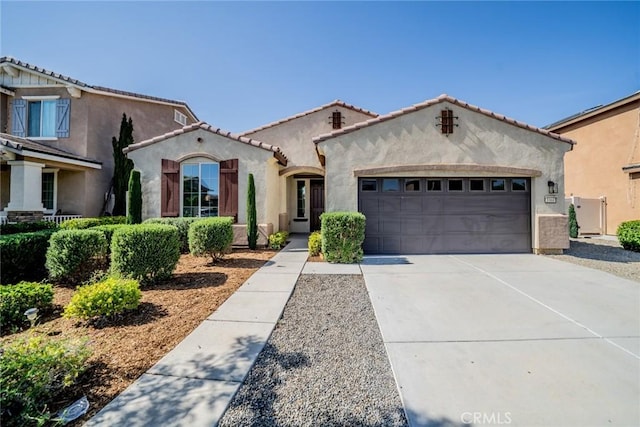1060 Fortuna St, Perris, CA 92571 - mediterranean / spanish house with an attached garage, stucco siding, and driveway