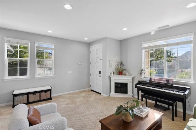 45614 Hawk Ct, Temecula, CA 92592 - living area with light tile patterned floors, recessed lighting, plenty of natural light, baseboards, and a glass covered fireplace