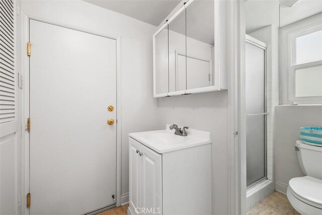 27 S La Senda Dr, Laguna Beach, CA 92651 - bathroom with toilet, a stall shower, and vanity