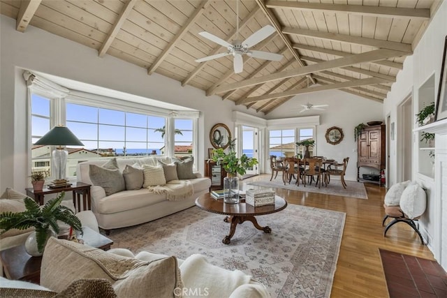 27 S La Senda Dr, Laguna Beach, CA 92651 - living room with wood ceiling with exposed beams, ceiling fan, wood finished floors, and high vaulted ceiling