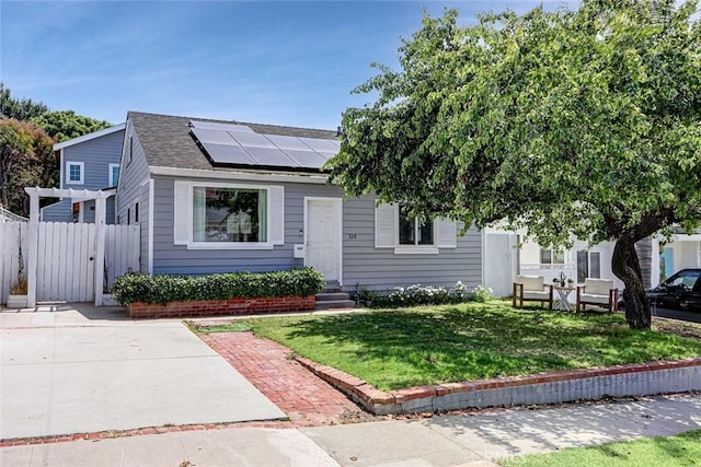 320 E Walnut Ave, El Segundo, CA 90245 - view of front of house featuring roof mounted solar panels and a shingled roof