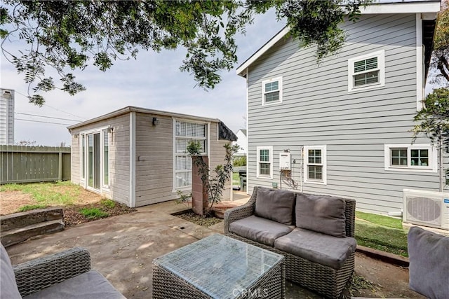 320 E Walnut Ave, El Segundo, CA 90245 - rear view of property featuring ac unit, a patio area, outdoor lounge area, and an outbuilding