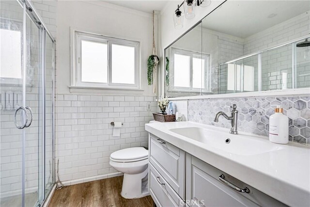 320 E Walnut Ave, El Segundo, CA 90245 - full bath with tile walls, vanity, a shower stall, and wood finished floors