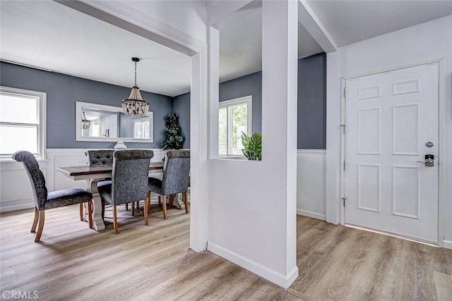 320 E Walnut Ave, El Segundo, CA 90245 - dining area with a chandelier, light wood-style floors, and baseboards