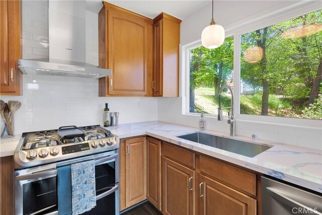 28720 Zion Dr, Lake Arrowhead, CA 92352 - kitchen with wall chimney exhaust hood, stainless steel appliances, a sink, backsplash, and light stone countertops