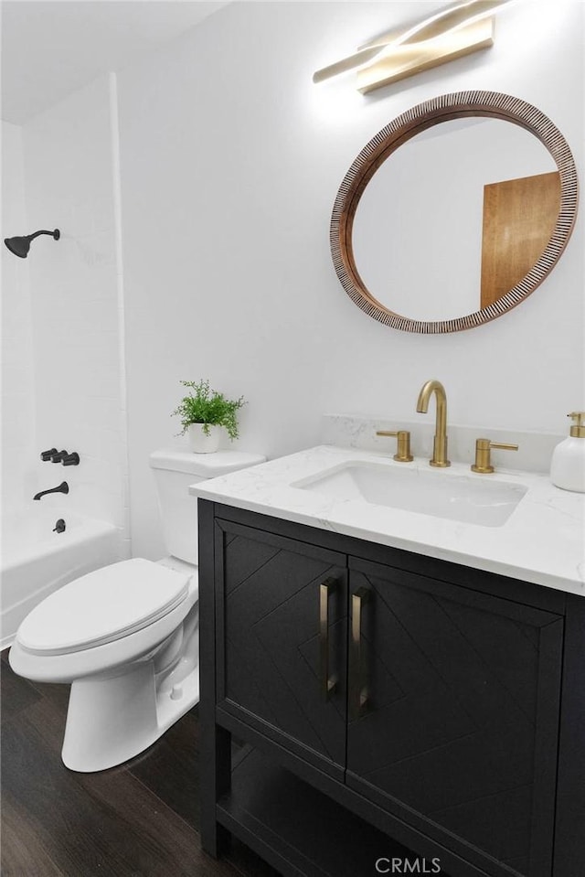 28720 Zion Dr, Lake Arrowhead, CA 92352 - full bath with vanity, wood finished floors, toilet, and washtub / shower combination