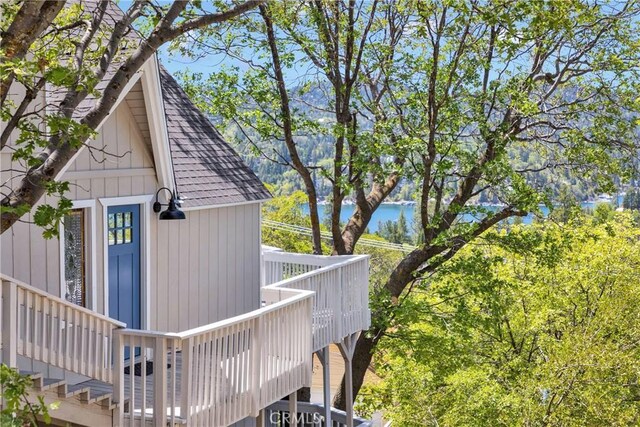 28720 Zion Dr, Lake Arrowhead, CA 92352 - view of side of home with roof with shingles and a deck with water view
