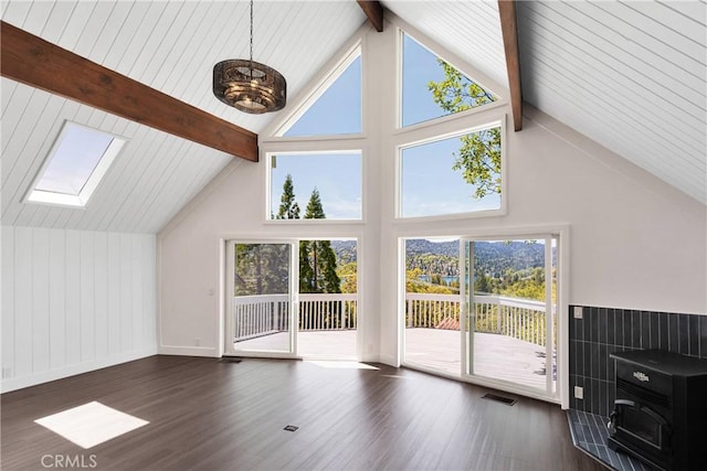 28720 Zion Dr, Lake Arrowhead, CA 92352 - unfurnished living room featuring wood finished floors, beamed ceiling, a skylight, and high vaulted ceiling