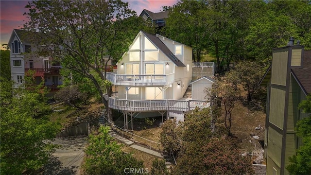 28720 Zion Dr, Lake Arrowhead, CA 92352 - back of property at dusk featuring stairway