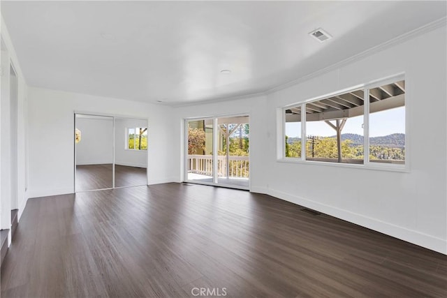 28720 Zion Dr, Lake Arrowhead, CA 92352 - unfurnished living room with dark wood finished floors and crown molding
