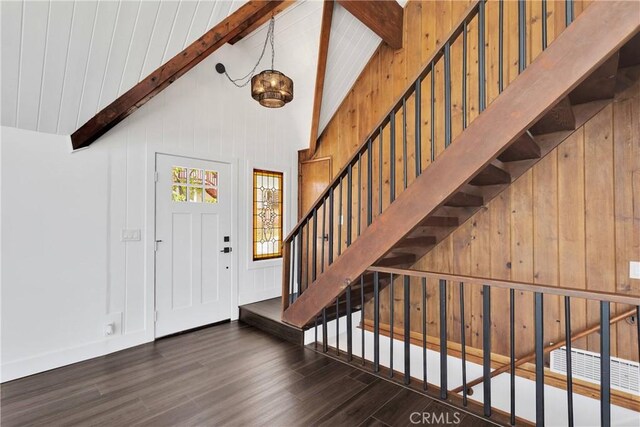 28720 Zion Dr, Lake Arrowhead, CA 92352 - foyer entrance with wood finished floors, beam ceiling, stairs, high vaulted ceiling, and wood walls