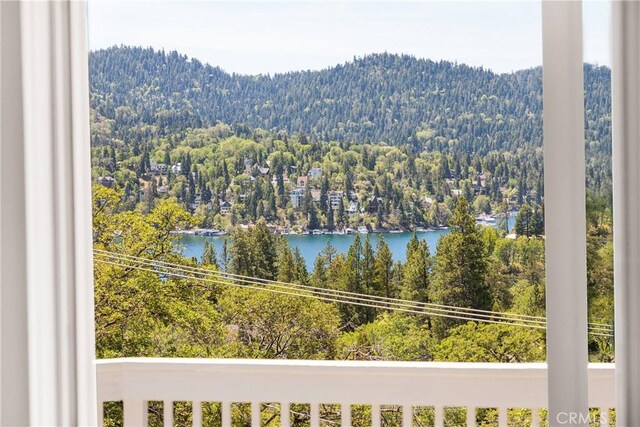 28720 Zion Dr, Lake Arrowhead, CA 92352 - water view featuring a heavily wooded area and a mountain backdrop