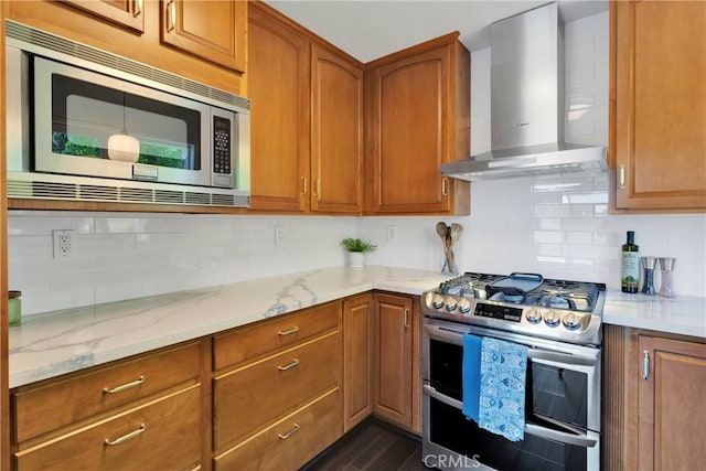 28720 Zion Dr, Lake Arrowhead, CA 92352 - kitchen featuring stainless steel appliances, wall chimney range hood, light stone countertops, and backsplash