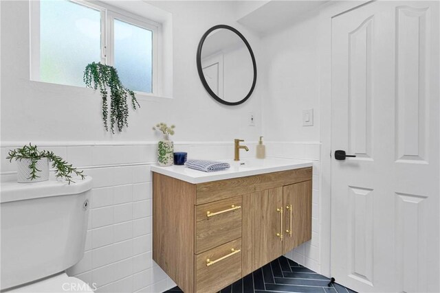 28720 Zion Dr, Lake Arrowhead, CA 92352 - bathroom featuring toilet, vanity, and wainscoting