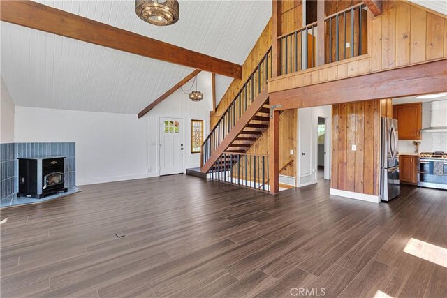 28720 Zion Dr, Lake Arrowhead, CA 92352 - unfurnished living room with high vaulted ceiling, stairs, baseboards, beamed ceiling, and dark wood-type flooring