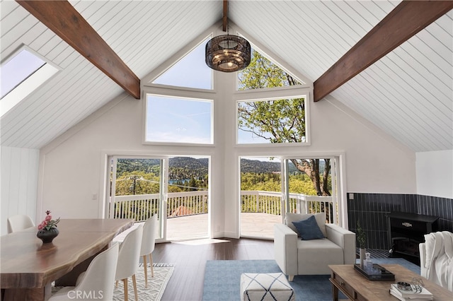 28720 Zion Dr, Lake Arrowhead, CA 92352 - living area featuring wood finished floors, beamed ceiling, plenty of natural light, and high vaulted ceiling