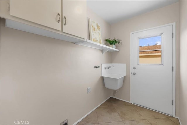 1840 W Southgate Ave, Fullerton, CA 92833 - washroom with cabinet space, light tile patterned flooring, baseboards, and hookup for an electric dryer