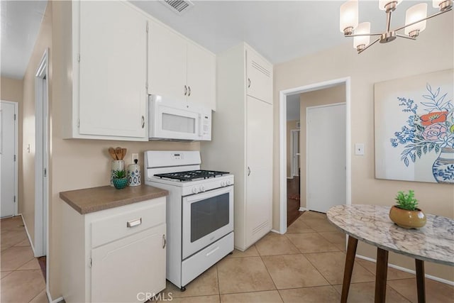 1840 W Southgate Ave, Fullerton, CA 92833 - kitchen with white appliances, light tile patterned floors, white cabinets, and a chandelier