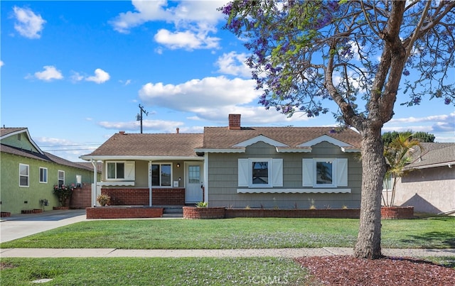 1840 W Southgate Ave, Fullerton, CA 92833 - view of front of property with a porch, a chimney, a front yard, and a shingled roof