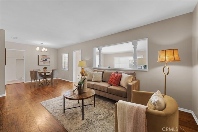 1840 W Southgate Ave, Fullerton, CA 92833 - living area featuring a chandelier, wood finished floors, and baseboards