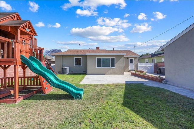 1840 W Southgate Ave, Fullerton, CA 92833 - rear view of house with stucco siding, central air condition unit, a playground, and a patio area