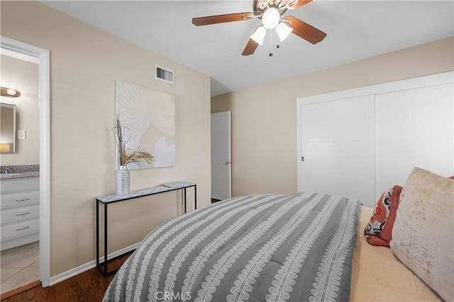 1840 W Southgate Ave, Fullerton, CA 92833 - bedroom featuring a closet, connected bathroom, wood finished floors, and ceiling fan