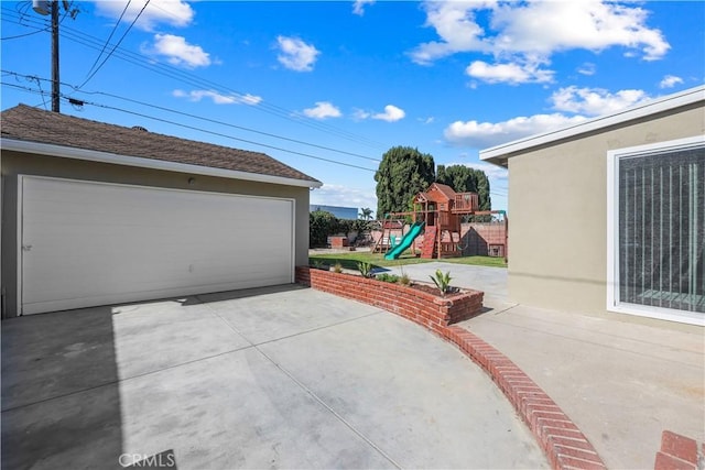 1840 W Southgate Ave, Fullerton, CA 92833 - view of patio featuring a playground, a garage, and an outdoor structure