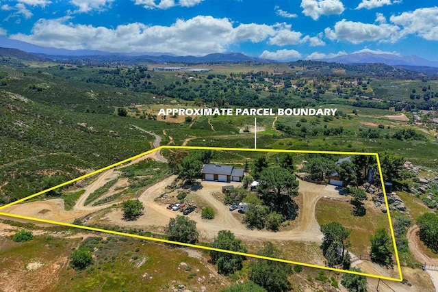 21057 Sutherland Dam Rd, Ramona, CA 92065 - aerial view of property and surrounding area featuring a mountain backdrop and property parcel outlined