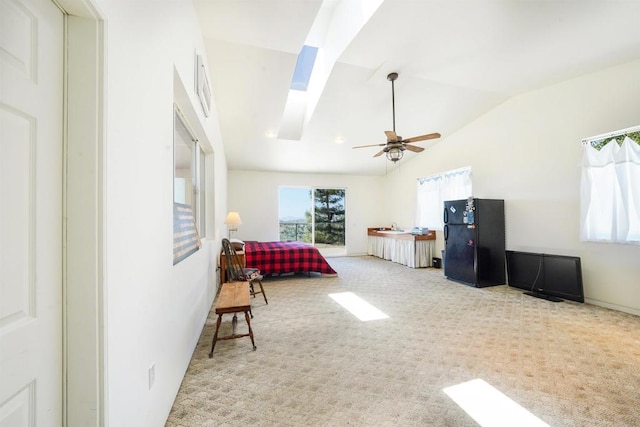 21057 Sutherland Dam Rd, Ramona, CA 92065 - carpeted bedroom featuring lofted ceiling, freestanding refrigerator, a skylight, and ceiling fan