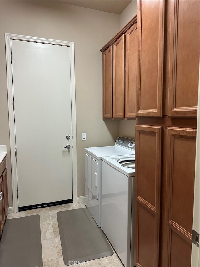 10030 El Dorado St, Apple Valley, CA 92308 - laundry room featuring washer and dryer, cabinet space, and baseboards