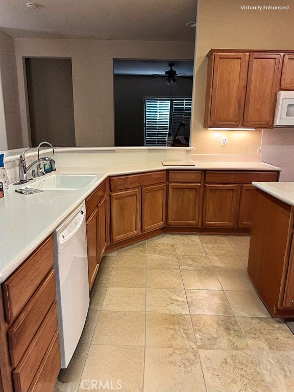 10030 El Dorado St, Apple Valley, CA 92308 - kitchen with white appliances, a sink, brown cabinets, and light countertops