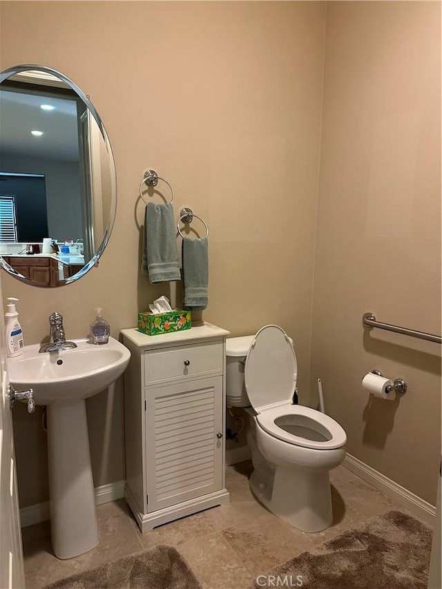 10030 El Dorado St, Apple Valley, CA 92308 - bathroom featuring toilet and baseboards