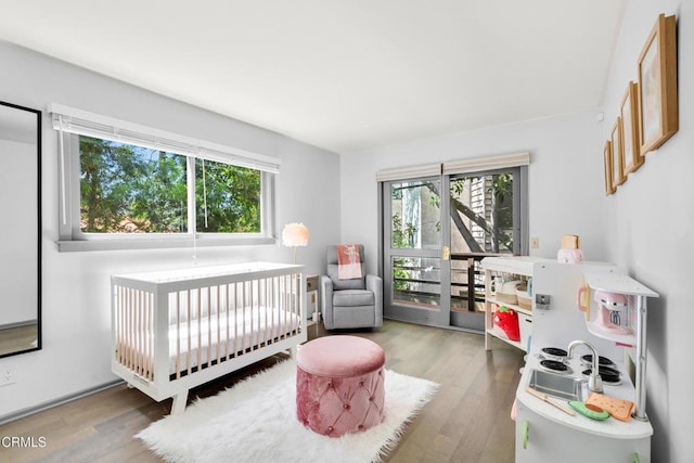 684 Orange Dr, Sierra Madre, CA 91024 - bedroom featuring multiple windows and wood finished floors