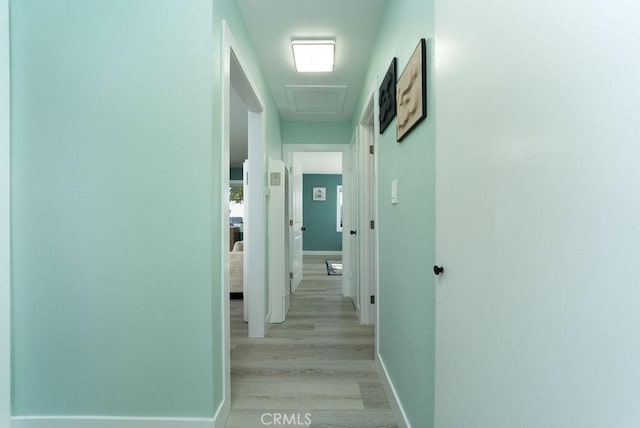 1405 W Saint Gertrude Pl, Santa Ana, CA 92704 - corridor with light wood finished floors, baseboards, and attic access