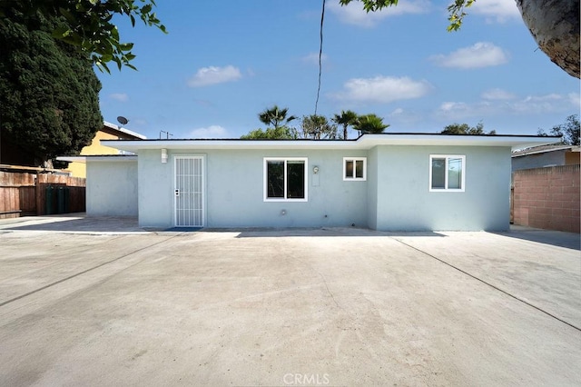 1405 W Saint Gertrude Pl, Santa Ana, CA 92704 - back of property featuring stucco siding and a patio area