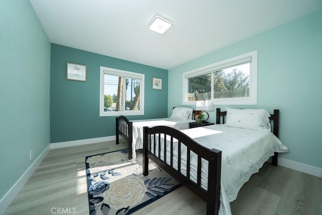 1405 W Saint Gertrude Pl, Santa Ana, CA 92704 - bedroom with wood finished floors and baseboards