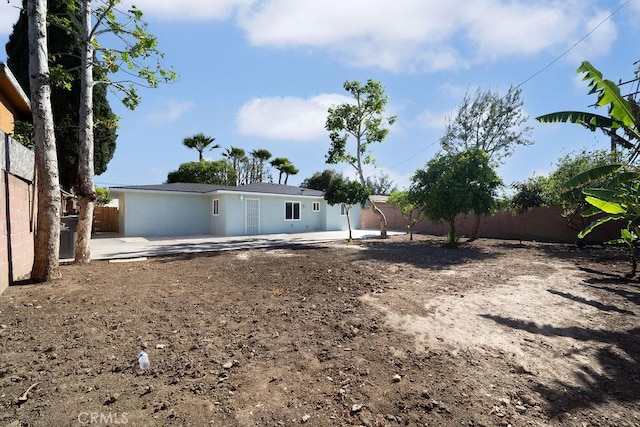 1405 W Saint Gertrude Pl, Santa Ana, CA 92704 - back of house featuring a fenced backyard and a patio