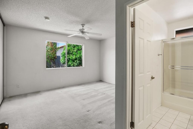 241 Saguaro Pl, Oceanside, CA 92057 - full bathroom with a ceiling fan, washtub / shower combination, tile patterned flooring, and a textured ceiling