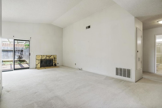 241 Saguaro Pl, Oceanside, CA 92057 - unfurnished living room with carpet, a textured ceiling, a stone fireplace, and lofted ceiling