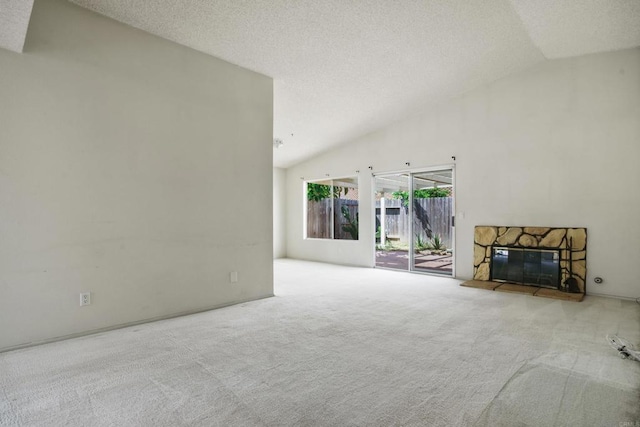 241 Saguaro Pl, Oceanside, CA 92057 - unfurnished living room with carpet, a fireplace, a textured ceiling, and high vaulted ceiling