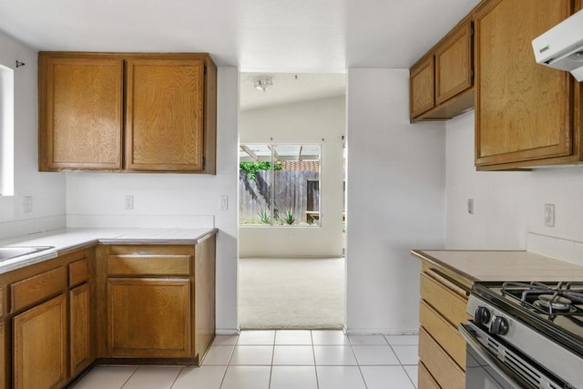 241 Saguaro Pl, Oceanside, CA 92057 - kitchen featuring light colored carpet, brown cabinets, light countertops, and range hood