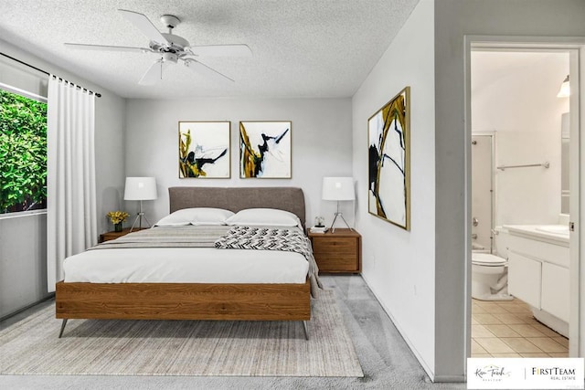 241 Saguaro Pl, Oceanside, CA 92057 - bedroom with ensuite bathroom, a textured ceiling, and a ceiling fan