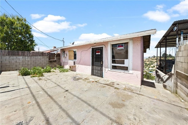 3117 Amethyst St, Los Angeles, CA 90032 - back of house with stucco siding and a patio