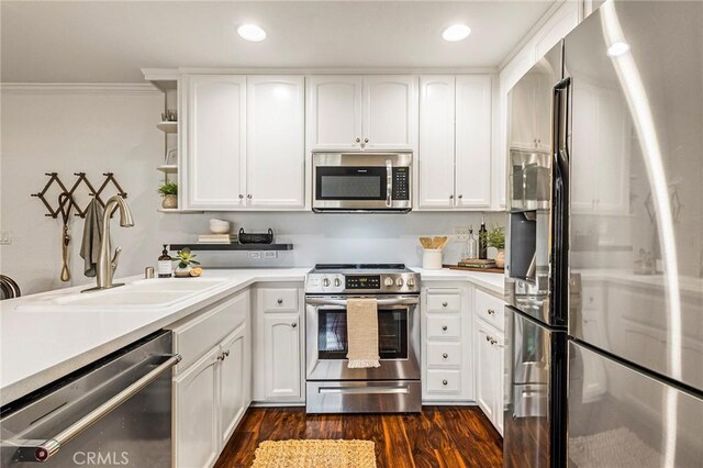 1125 Sheridan Ave Unit 68, Chico, CA 95926 - kitchen featuring appliances with stainless steel finishes, a sink, dark wood-style floors, light countertops, and white cabinets
