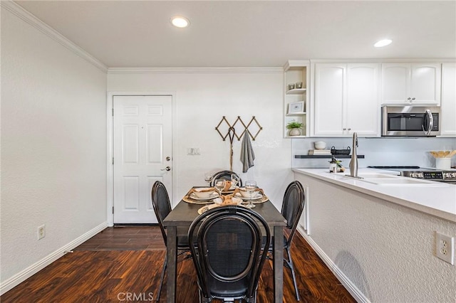 1125 Sheridan Ave Unit 68, Chico, CA 95926 - dining space with crown molding, baseboards, dark wood finished floors, and recessed lighting